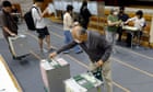 Japan’s ruling coalition at risk of losing majority in election, exit polls show