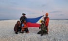 China and Philippines display competing flags on disputed South China Sea sandbank
